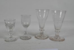 A pair of Georgian ale glasses, a Georgian illusion glass, and another, largest 6" high