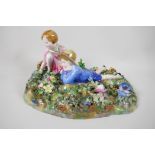 A Crown Staffordshire figurine of two children in a garden, modelled by T. Bayley, A/F, 12" long