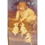 A Victorian chrystoleum depicting a young girl with three puppies, 6½" x 10"