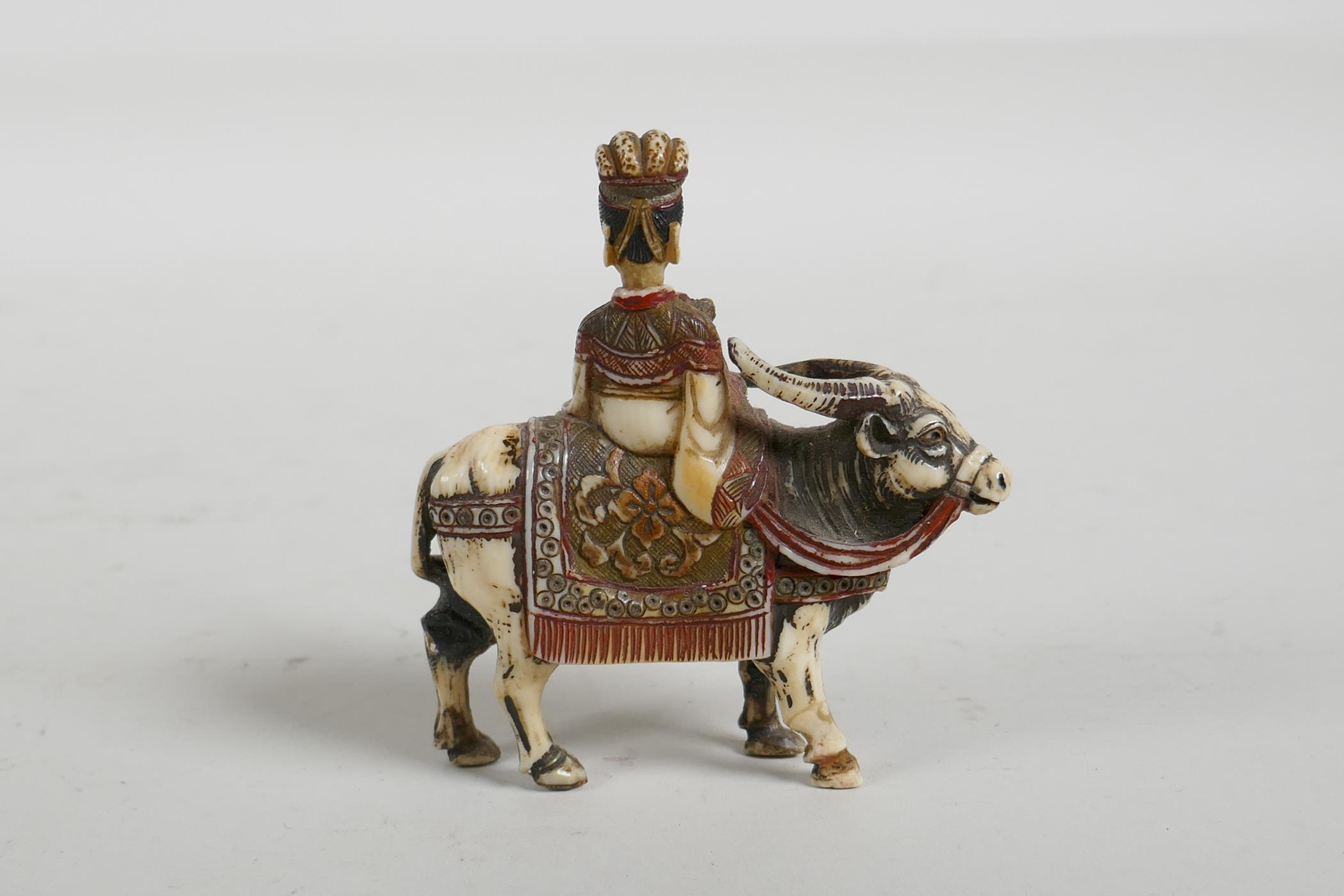 A C19th carved and stained bone snuff bottle in the form of a Chinese man riding a yak, 3" high - Image 4 of 5