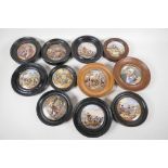 Eleven Prattware pot lids in turned wood frames, including "The Village Wedding", "Peace", and "That