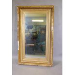 A large antique gilt framed wall mirror late, 43" x 21"