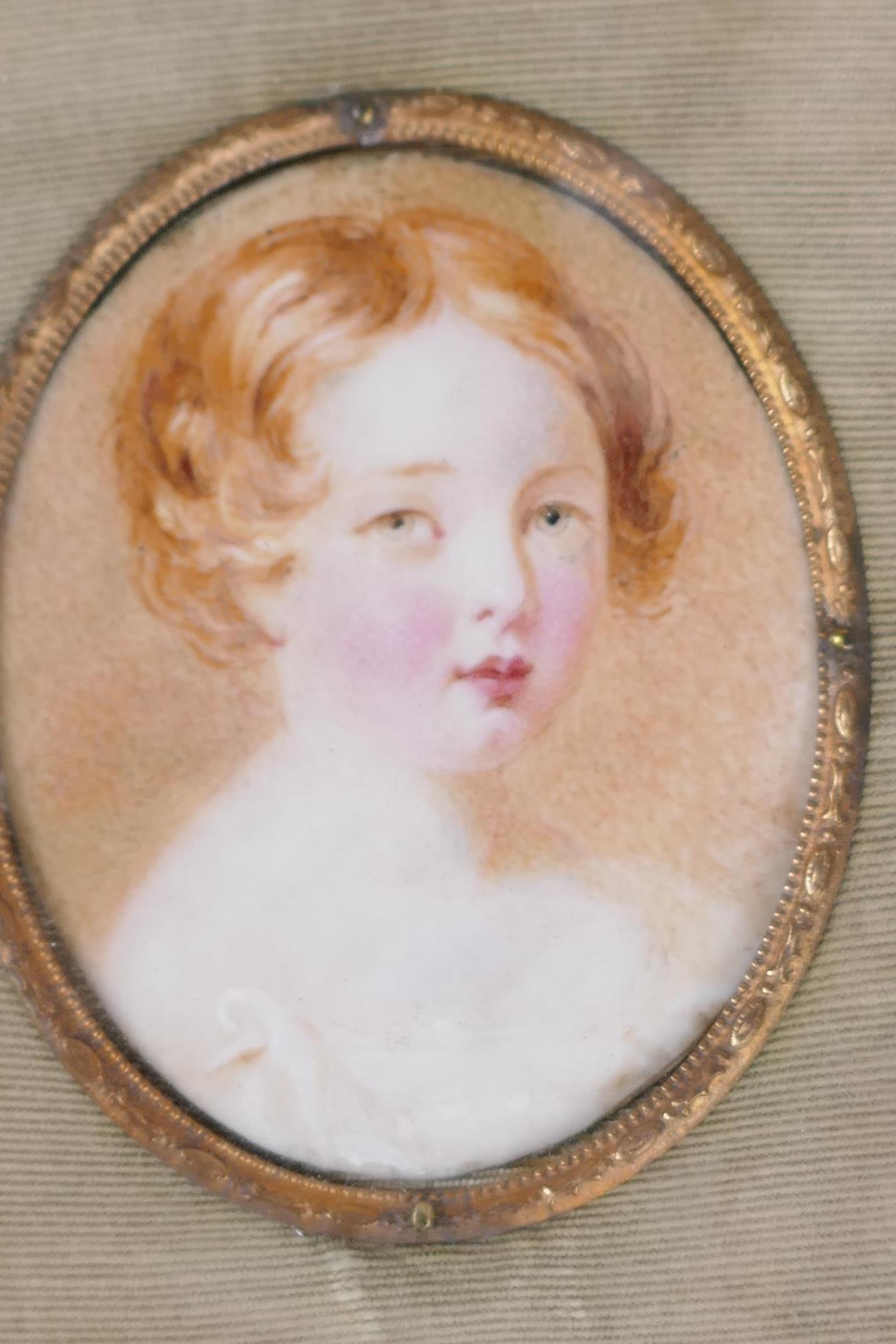 An early C19th miniature portrait of a Georgian child, in elaborate gilt metal frame, portrait 1½" x - Image 2 of 2