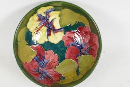 A Moorcroft pottery bowl decorated with hibiscus flowers, 6" diameter