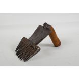 A C19th Islamic steel carpet comb with incised decoration, 6½" long