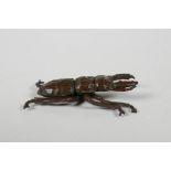 A Japenese Jizai style bronze stag beetle, indistinct mark to base, 2½" long