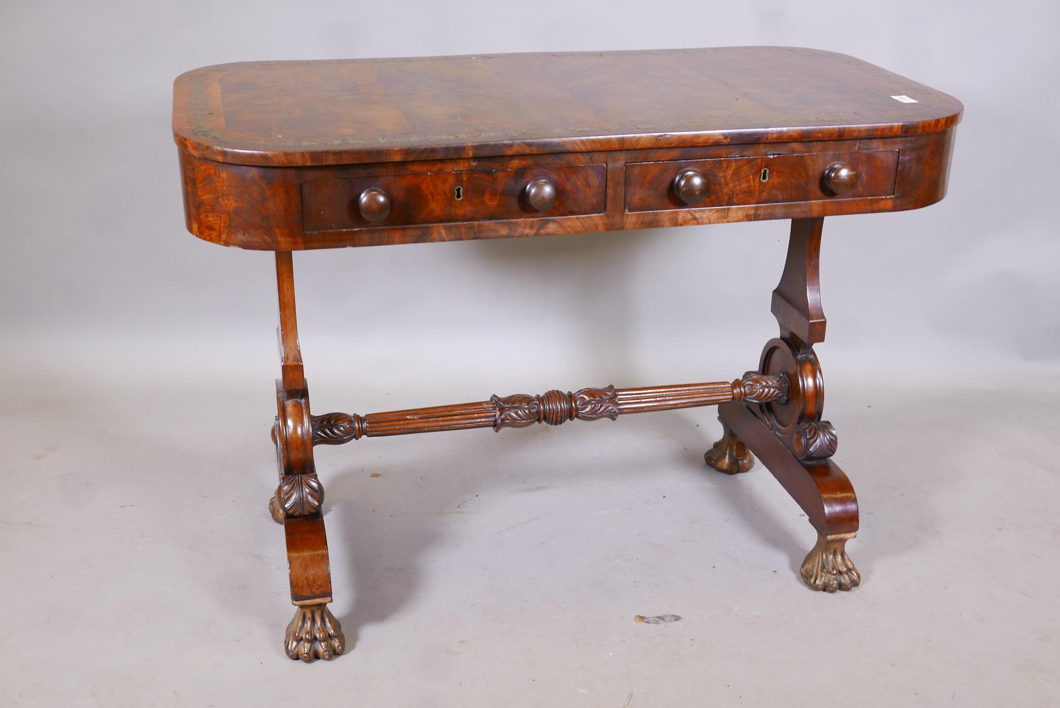 A C19th flame mahogany centre table, with two true and two false drawers, the top with rosewood