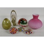 Three decorative glass paperweights ,three millefiori weights and a squat satin glass vase