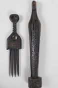 An African carved ebony figure at prayer, 13" high, and a carved wood ethnic comb, (Ivory coast)