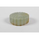 A Chinese carved celadon jade box and cover, 2" diameter