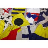 Twelve vintage Royal Navy ship's signal flags, hand stitched linen with bronze toggles, mostly