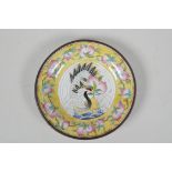 A yellow ground Canton enamel dish, decorated with a red crowned crane & peaches, Chinese, with