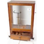 A rare "Westphal Balance", in mahogany and glass case, complete with instructions for use, 17½" high