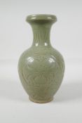A song style olive glazed pottery vase, with incised scrolling lotus flower decoration, 9" high