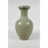 A song style olive glazed pottery vase, with incised scrolling lotus flower decoration, 9" high