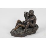 A bronzed composition figurine of a courting couple from Genesis Fine Art, 5½" high
