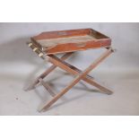 A C19th mahogany butler's tray, 28" x 17" x 4", with associated folding stand