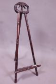 A Chinese carved hardwood easel, 24" high