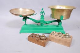 A set of 'Force' 5kg scales with brass bowls and two sets of metric weights, (incomplete), scales