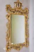 A Chinese Chippendale style giltwood wall mirror, 64" x 31"