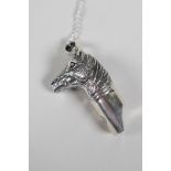 A sterling silver pendant whistle in the form of a horses head, on a 925 silver chain, 2" drop