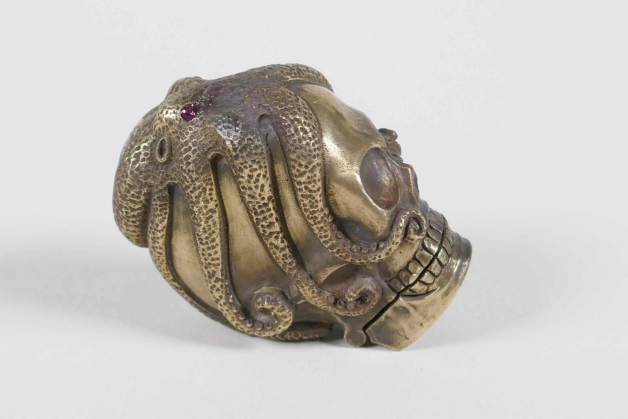 A brass vesta case in the form of an octopus atop a skull - Image 2 of 4