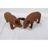 A pair of cast iron garden figures of piglets, 11" long