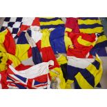 Seventeen Royal Navy Ship's signal flags, pennants and a white Ensign, flags mostly size 6, hand