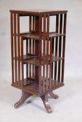 A Victorian mahogany revolving bookcase of slender proportions, 15" x 15" x 36"