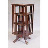 A Victorian mahogany revolving bookcase of slender proportions, 15" x 15" x 36"