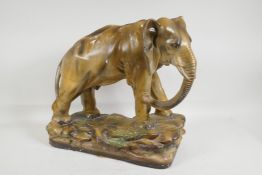 A painted plaster elephant, model OP402, 14" high, 16" long