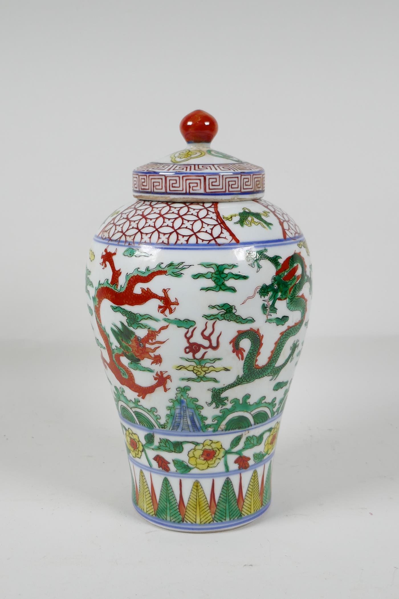 A Chinese Wucai porcelain Meiping jar & cover, decorated with dragons chasing the flaming pearl, 6