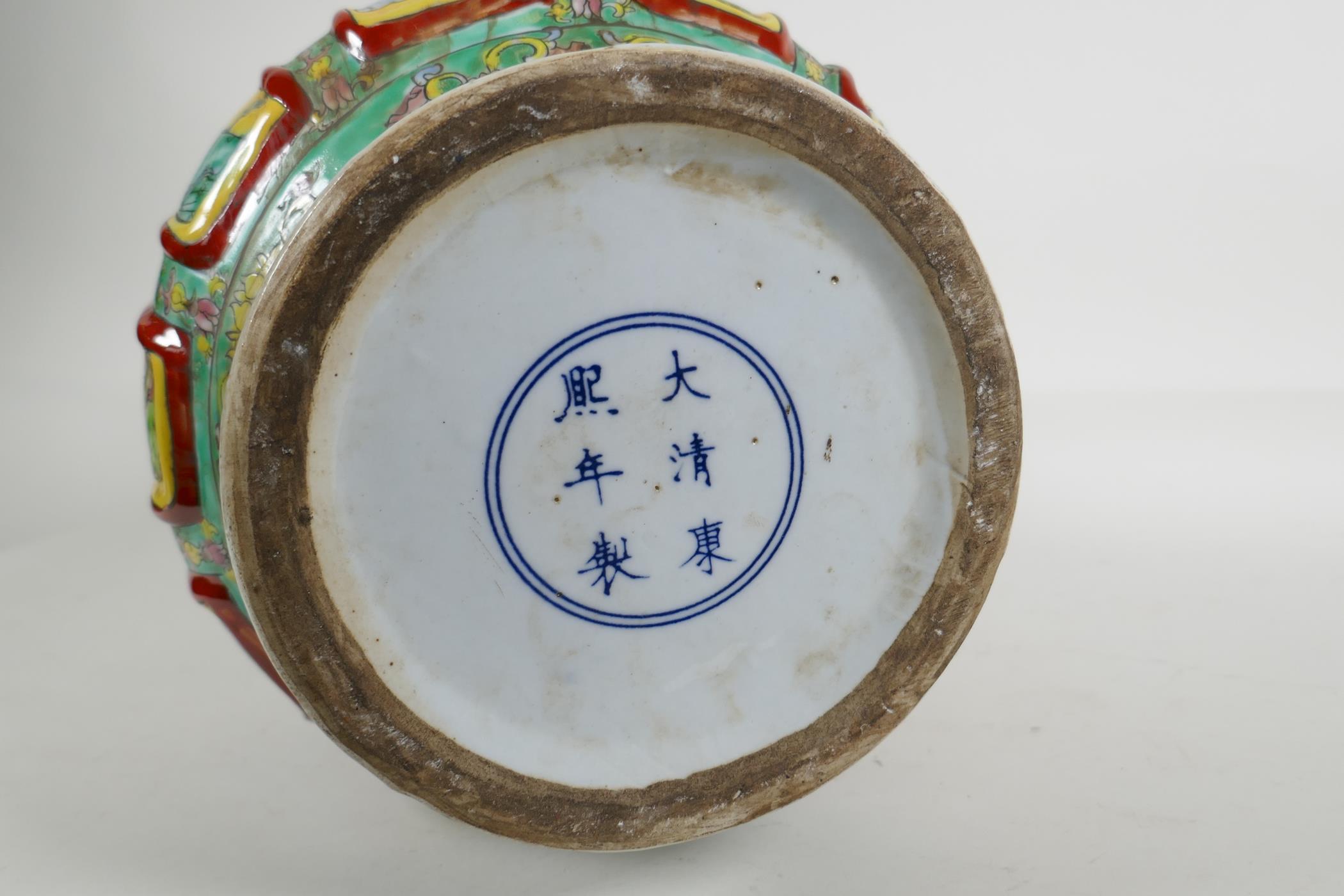 A Chinese polychrome porcelain two handled vase with raised decorative enamelled panels, depicting - Image 5 of 5