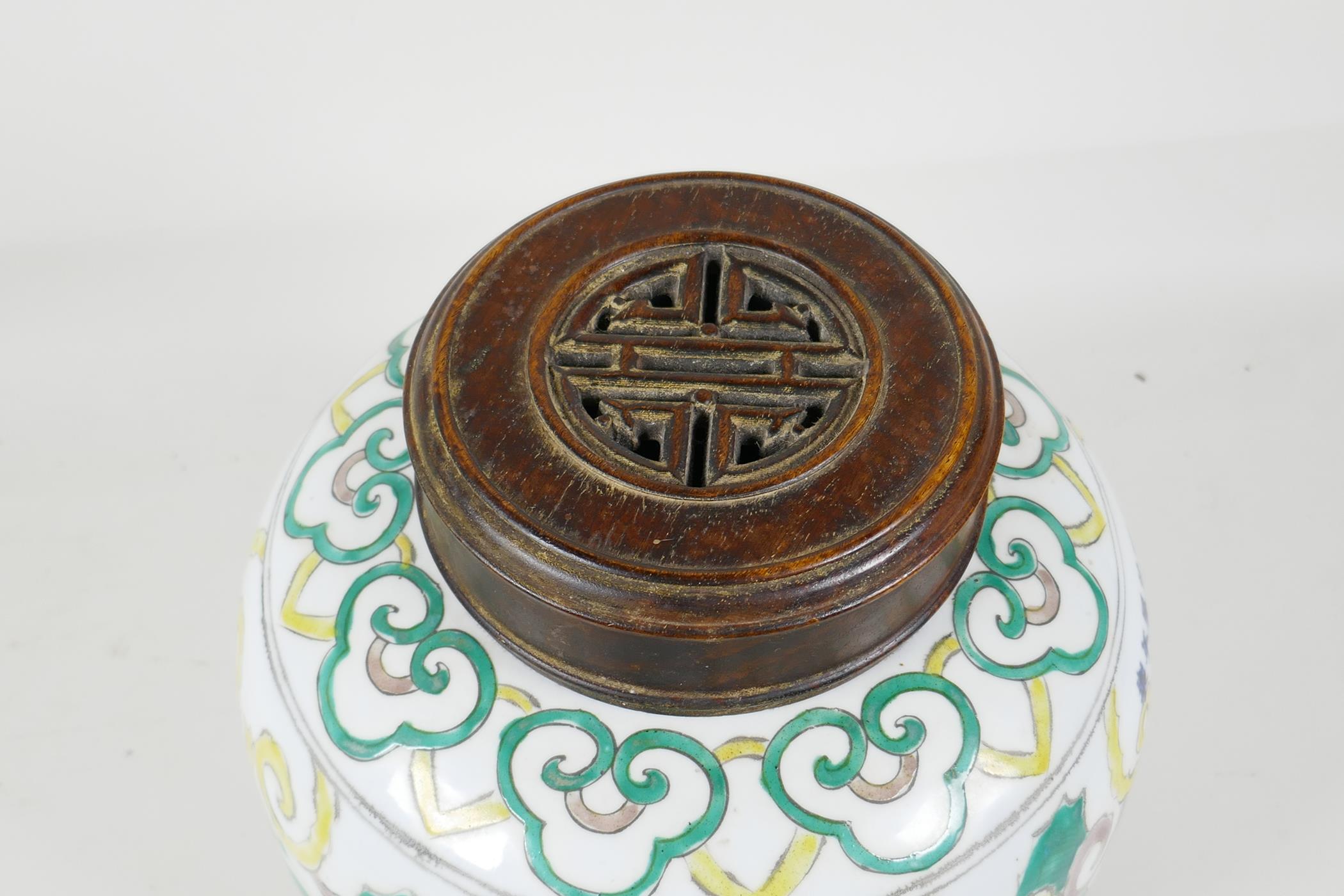 A Chinese Sancai glazed porcelain ginger jar with a turned wood cover, decorated with figures riding - Image 6 of 8