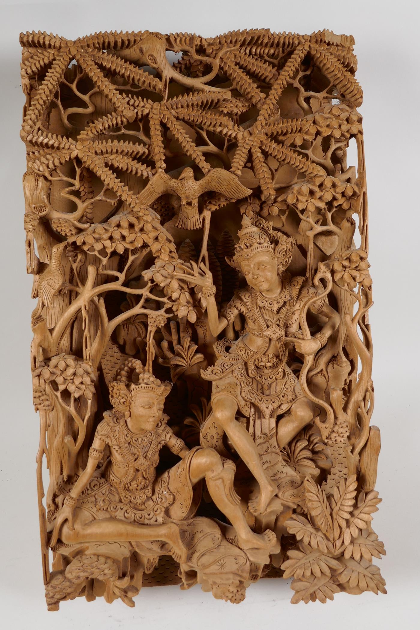 A Balinese carved sandlewood wall plaque, carved as two dancers resting under a tree, 16" x 9½" - Image 5 of 6