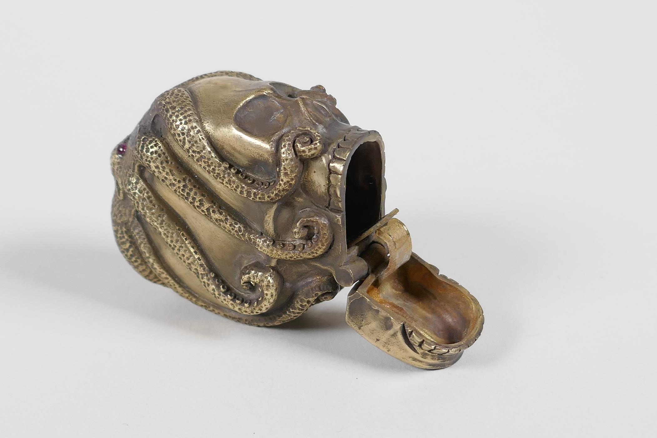 A brass vesta case in the form of an octopus atop a skull - Image 4 of 4