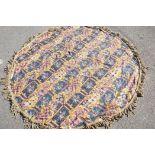 A large Victorian woven table cloth, with gilt tassled fringe, 84" diameter