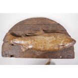 A driftwood wall palque mounted with a ceramic model of a salmon, 18" long