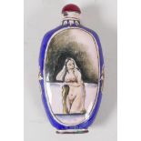 A Chinese enamel snuff bottle decorated with a female nude and lake landscape 4½" long