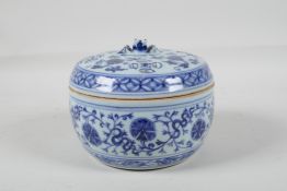 A Chinese blue and white porcelain cricket jar & pierced cover, with lotus flower decoration & an