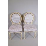 A pair of Victorian style balloon back chars with painted frames and Gingham upholstery