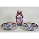 A pair of Japanese Imari porcelain cabinet plates with floral decoration, and an Imari porcelain