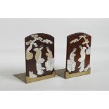 A pair of Chinese brass and hardwood bookends with applied carved Mother of Pearl decoration of