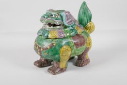 A Chinese Sancai glazed porcelain censer in the form of a fo-dog, 8" long x 8" high