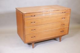 A mid century Butilux teak chest of four long drawers with moulded decoration, 39" x 20" x 28",