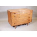 A mid century Butilux teak chest of four long drawers with moulded decoration, 39" x 20" x 28",