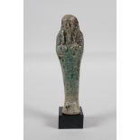 An Egyptian turquoise glazed faience shabti, 5" high