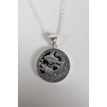 A sterling silver & onyx pendant necklace with Pisces star sign decoration, 1" diameter