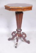 A C19th mahogany octagonal top occasional table, with segmented veneered top, raised on a tapering