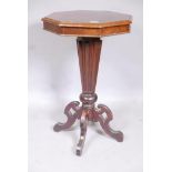 A C19th mahogany octagonal top occasional table, with segmented veneered top, raised on a tapering